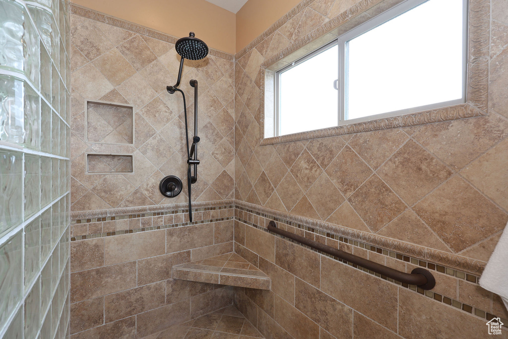Full bath with tiled shower