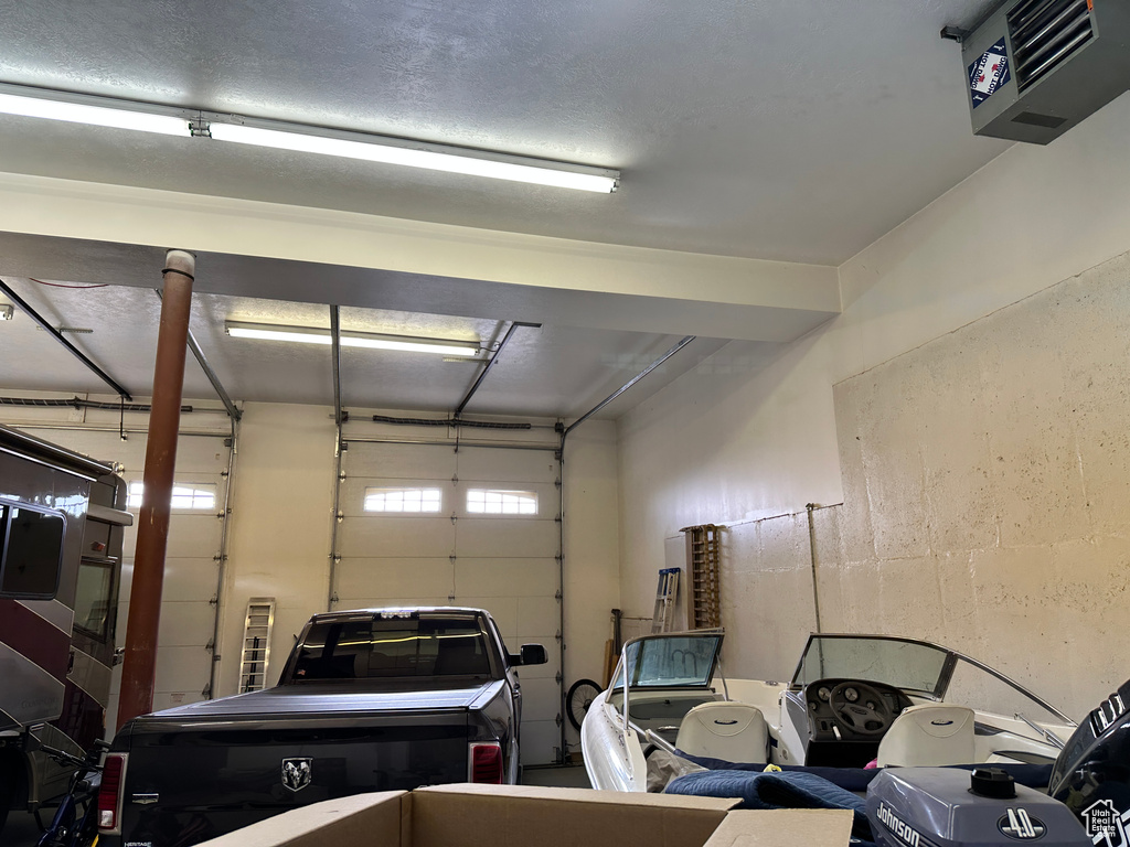 Garage featuring a heating unit