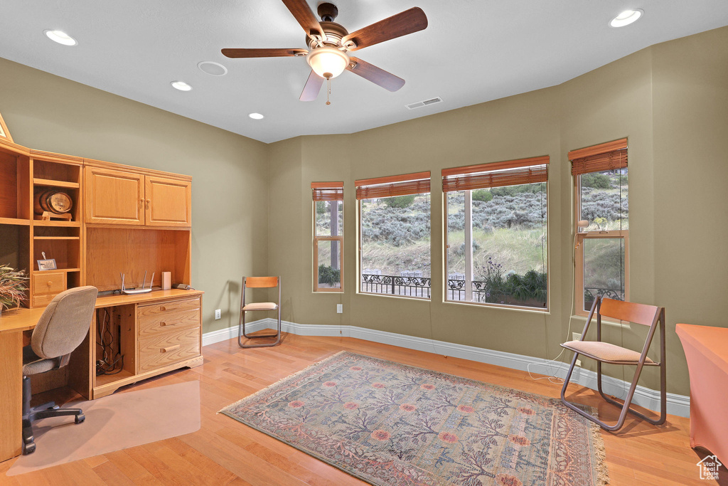 Home office with light wood-style flooring, a ceiling fan, baseboards, and recessed lighting
