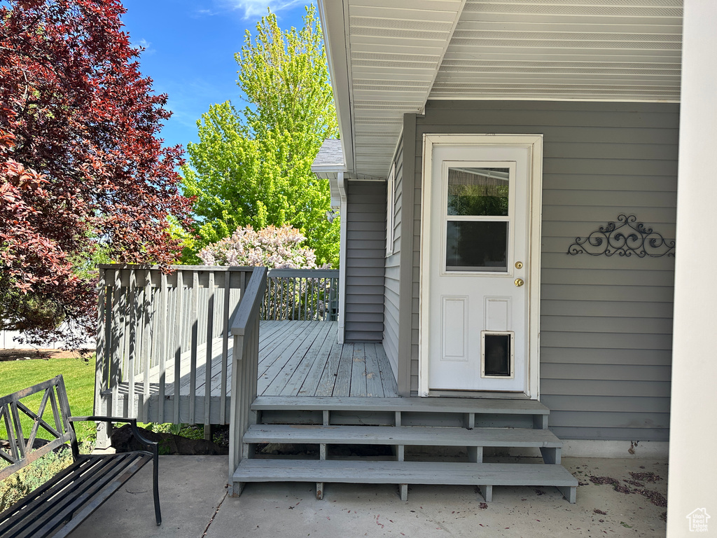 Doorway to property with a deck