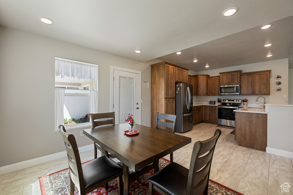 Dining room with baseboards and recessed lighting