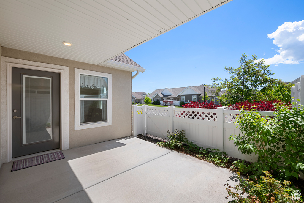 View of patio with a fenced backyard and a residential view