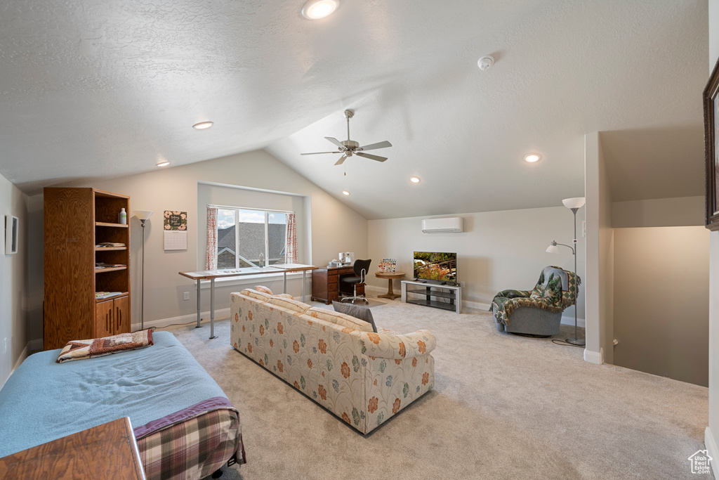 Living room with a wall unit AC, lofted ceiling, ceiling fan, light carpet, and recessed lighting