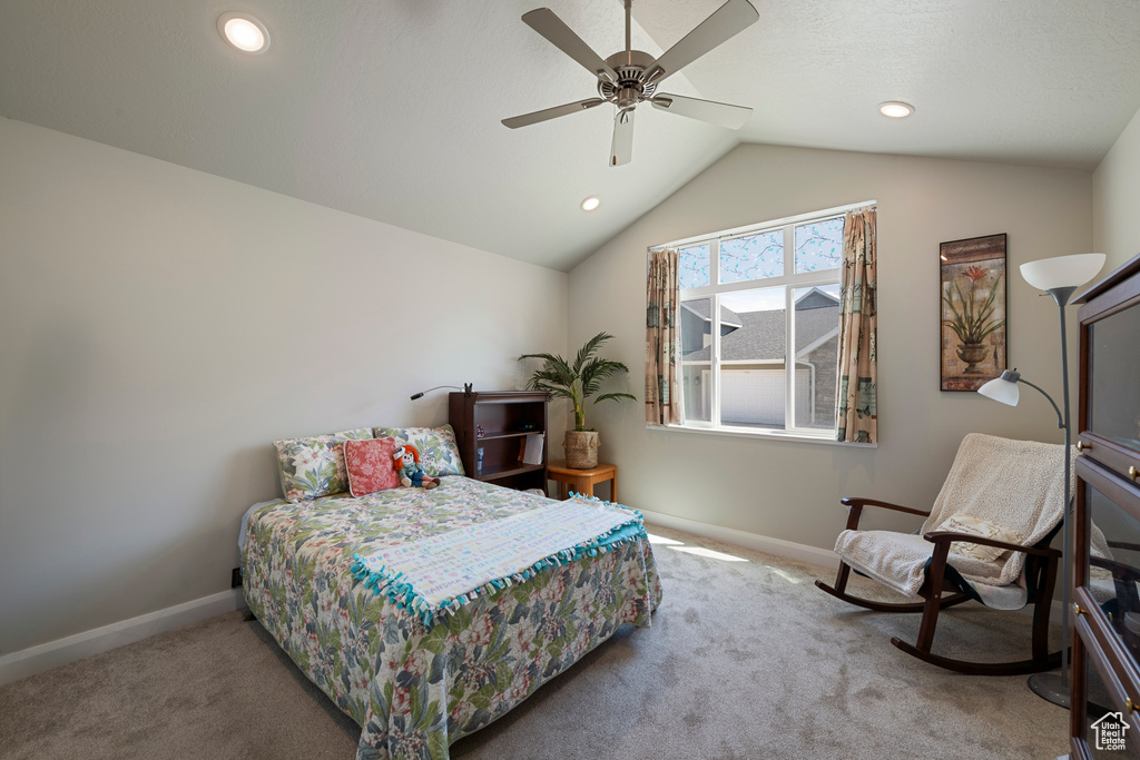 Carpeted bedroom featuring baseboards, vaulted ceiling, recessed lighting, and a ceiling fan