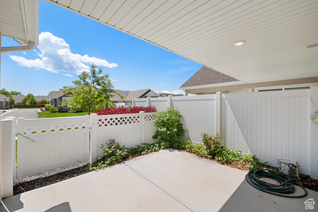 View of patio / terrace with fence and a residential view
