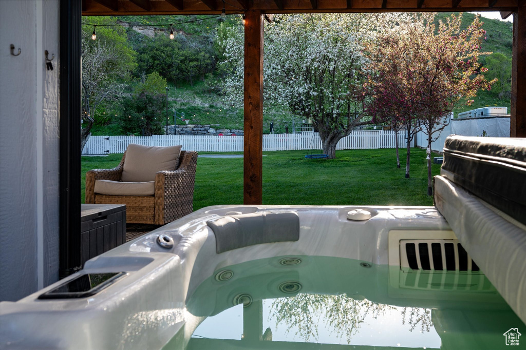 View of patio / terrace with a hot tub