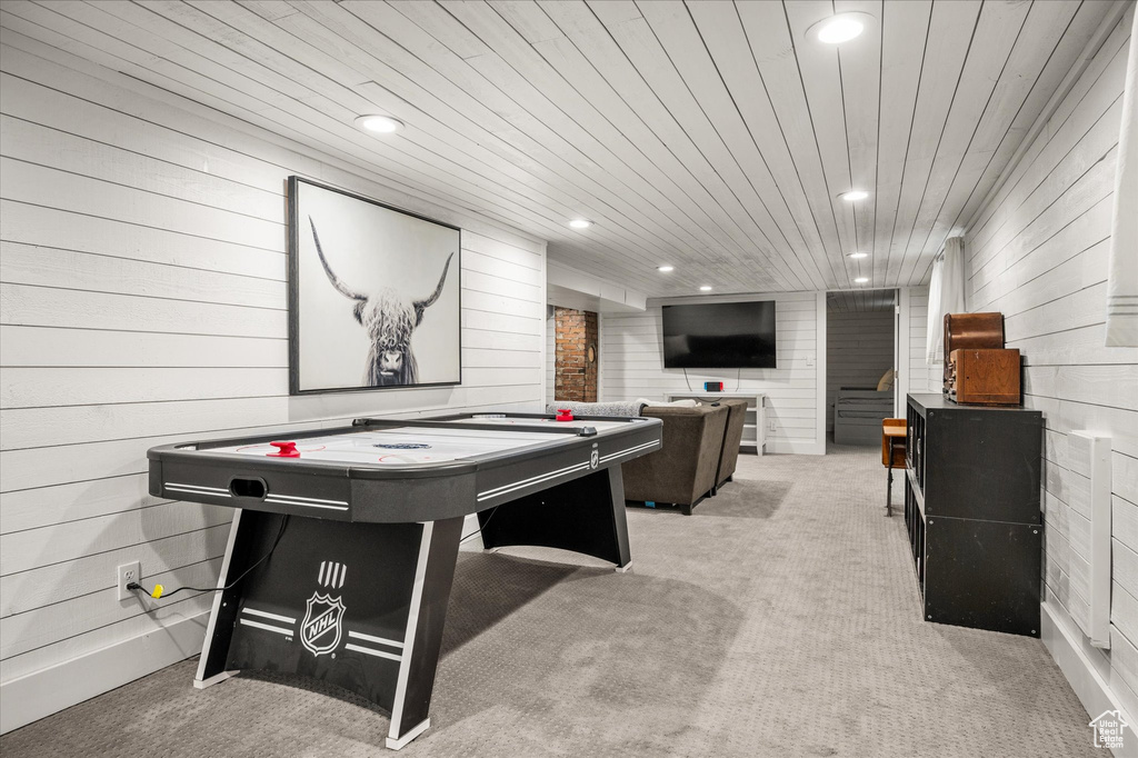Recreation room with wooden walls, light colored carpet, recessed lighting, wooden ceiling, and billiards