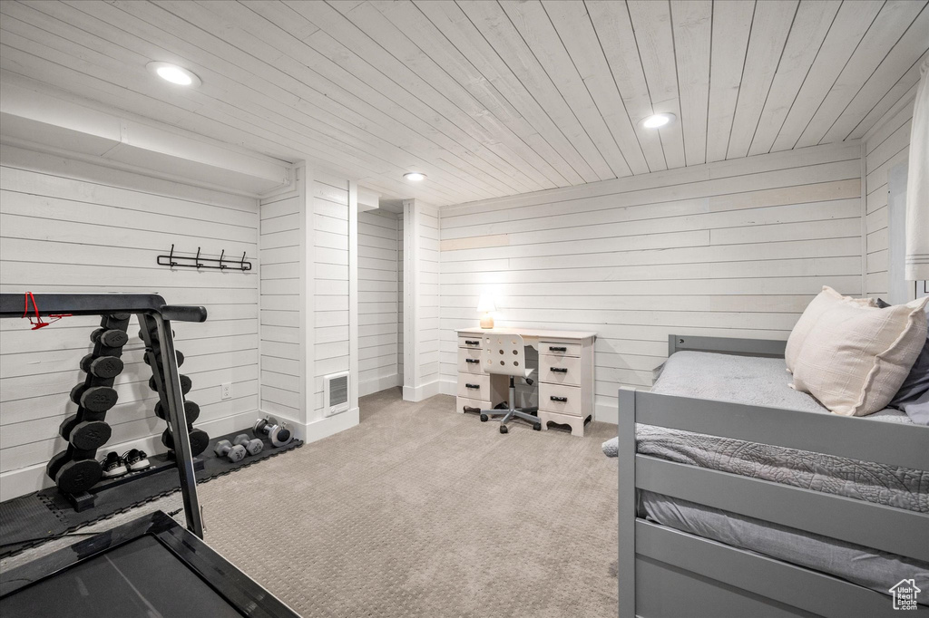 Workout room featuring wood walls, wood ceiling, recessed lighting, and carpet