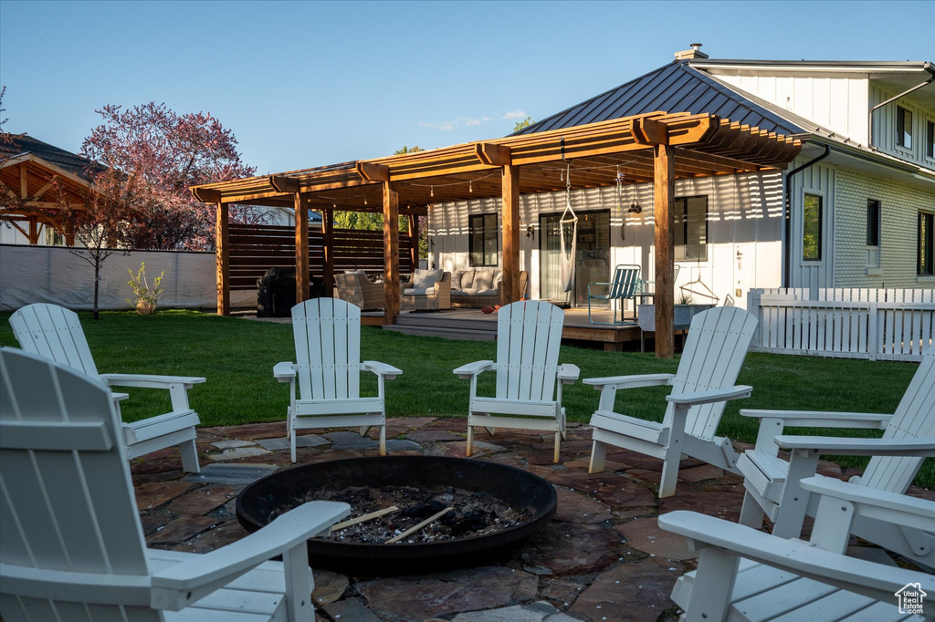 View of patio / terrace featuring an outdoor fire pit