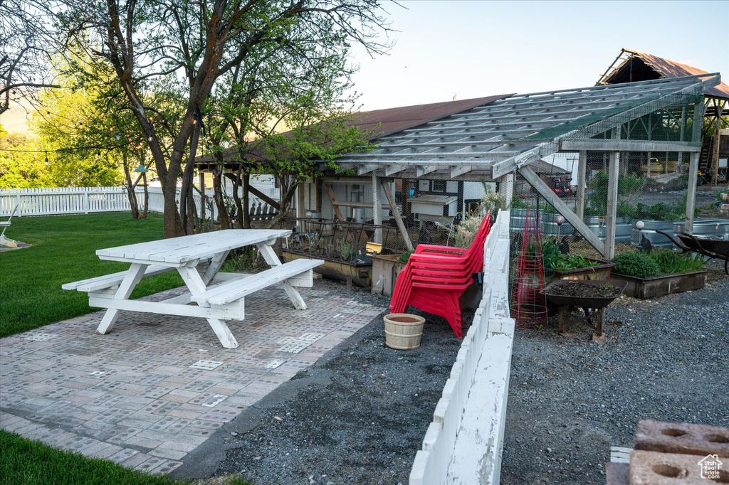 View of property\'s community featuring a patio area