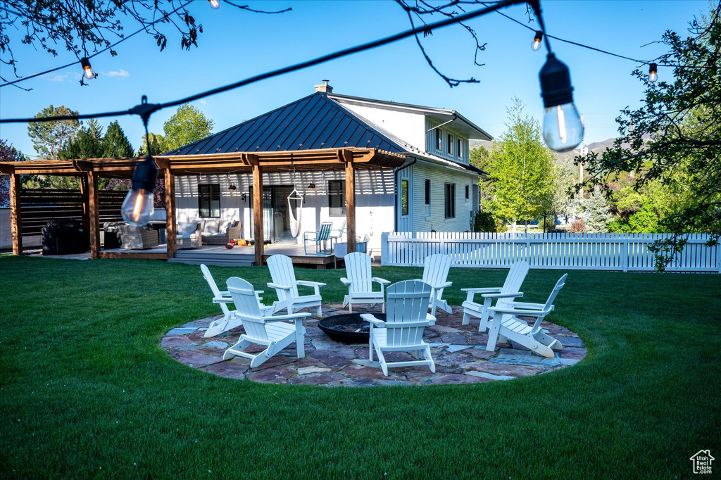 View of yard featuring an outdoor fire pit and a patio