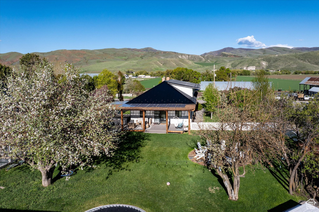 Aerial overview of property\'s location featuring a mountain backdrop