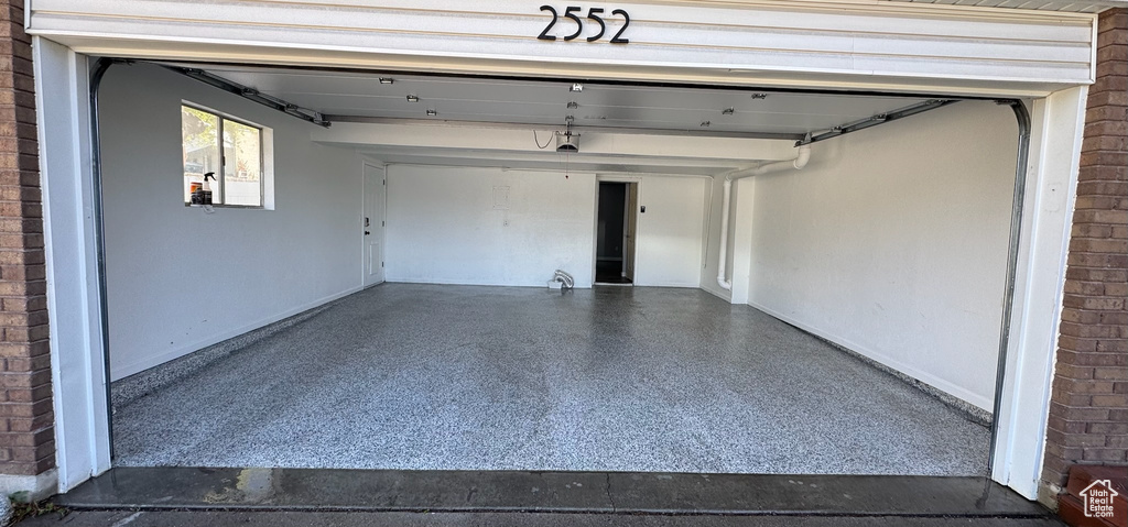 Garage featuring baseboards