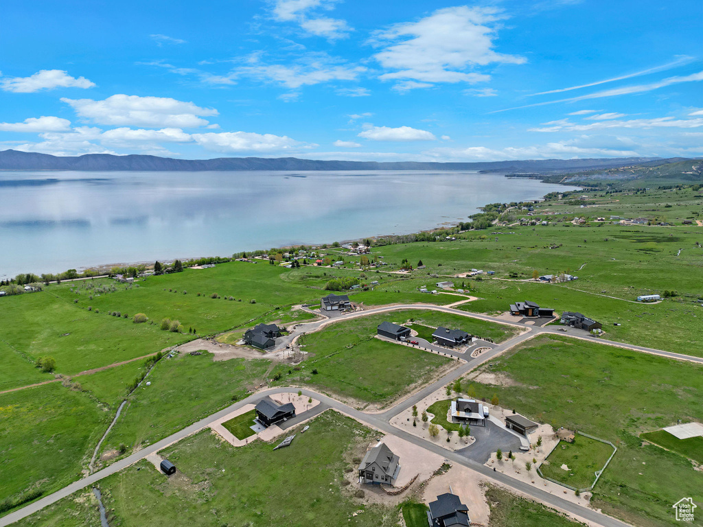 Aerial overview of property's location featuring a water and mountain view