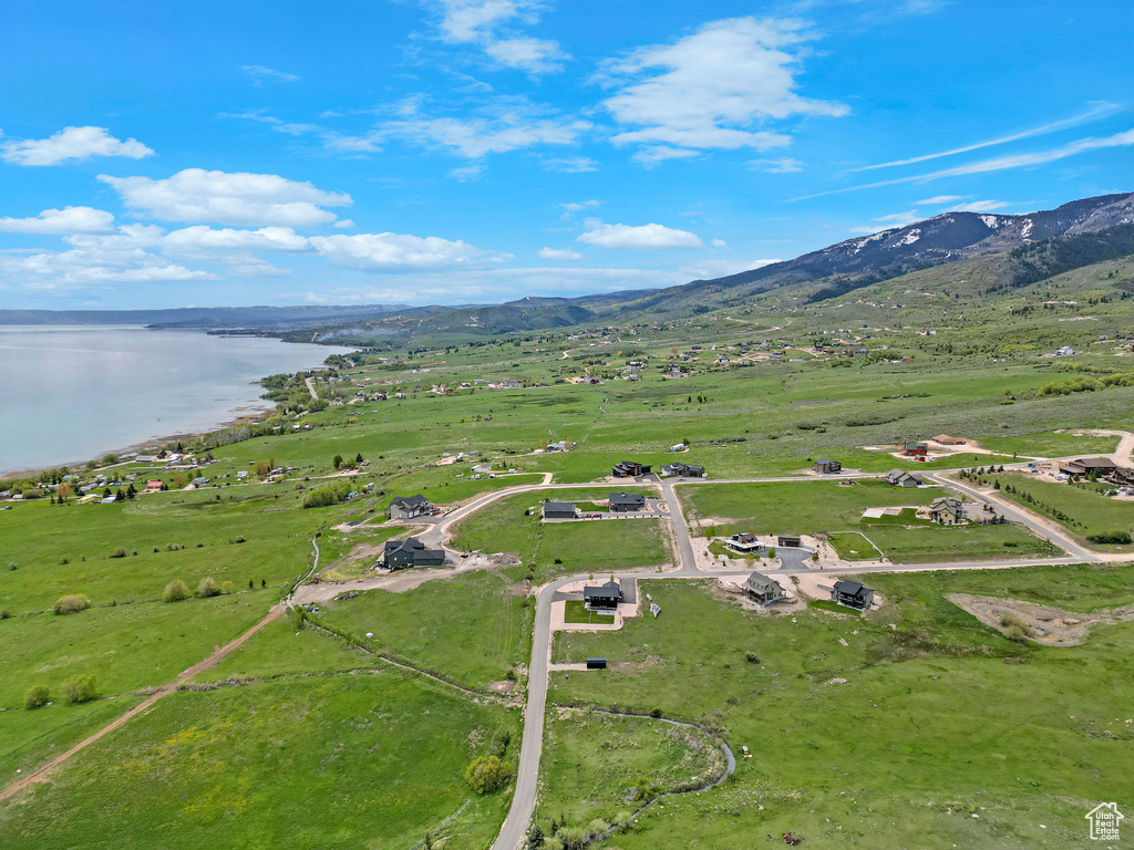 View of property location featuring a water and mountain view