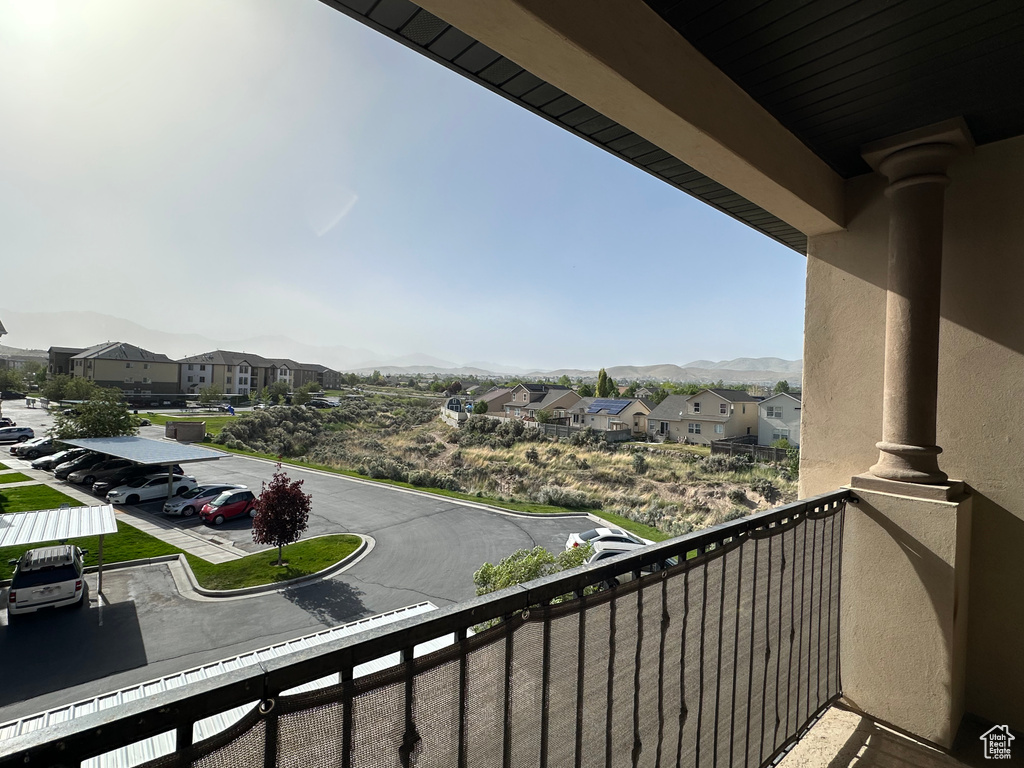 Balcony with a residential view and a mountain view