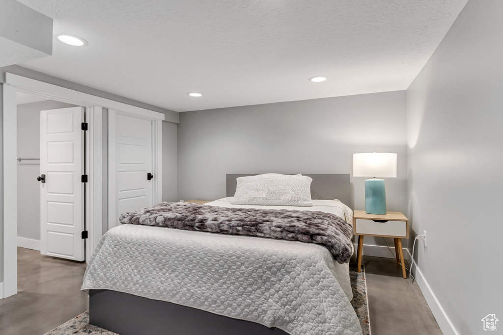 Bedroom with baseboards and recessed lighting