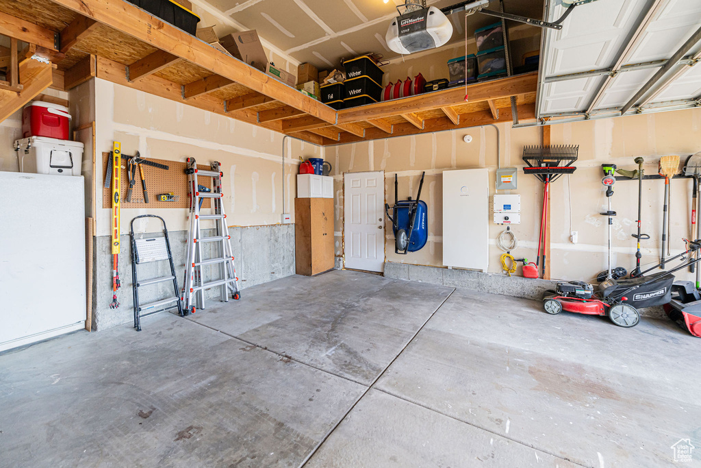 Garage featuring a garage door opener