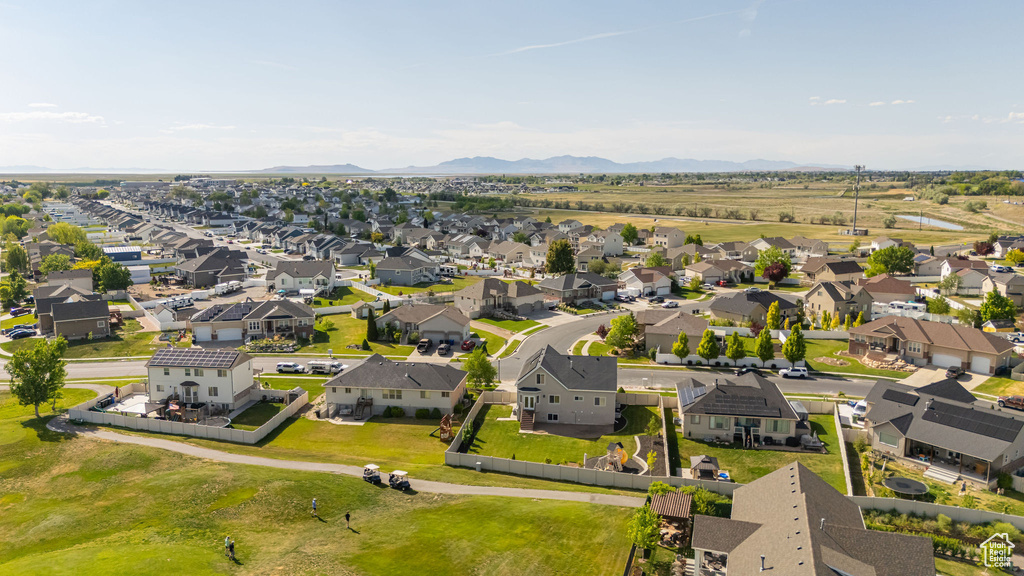Aerial perspective of suburban area with a mountain backdrop