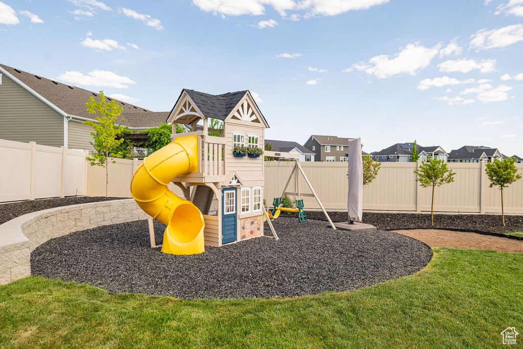 View of playground with a residential view