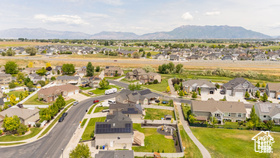 Aerial view of residential area featuring a mountainous background