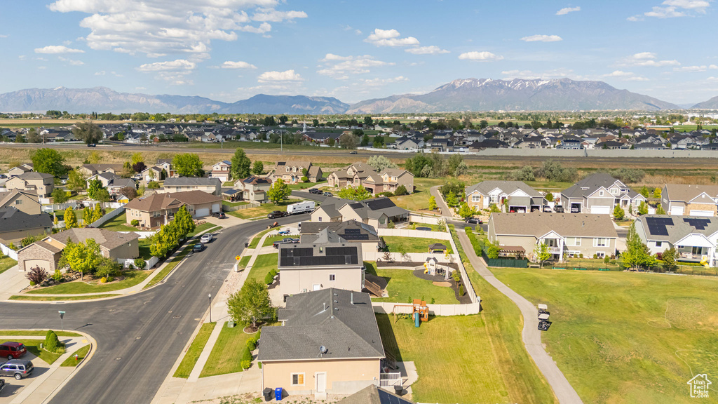 Aerial view of residential area featuring a mountain backdrop