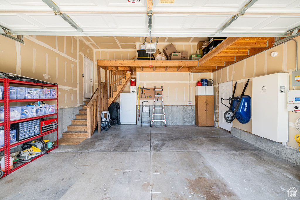 Garage featuring a garage door opener