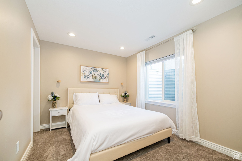 Bedroom featuring carpet, recessed lighting, and baseboards