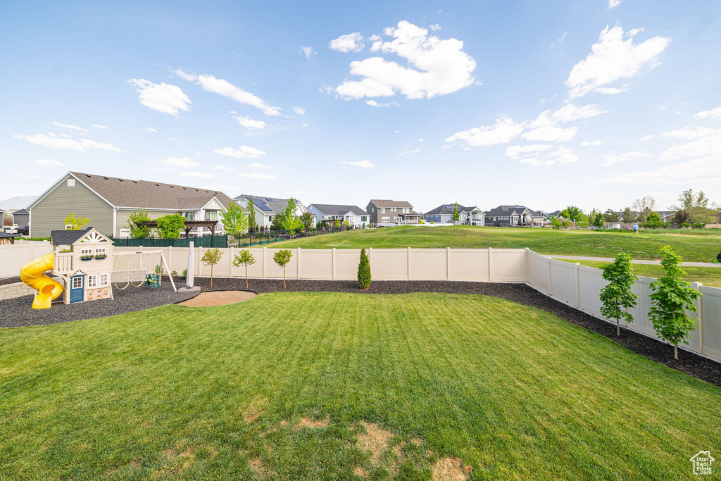 View of yard featuring a residential view and a playground