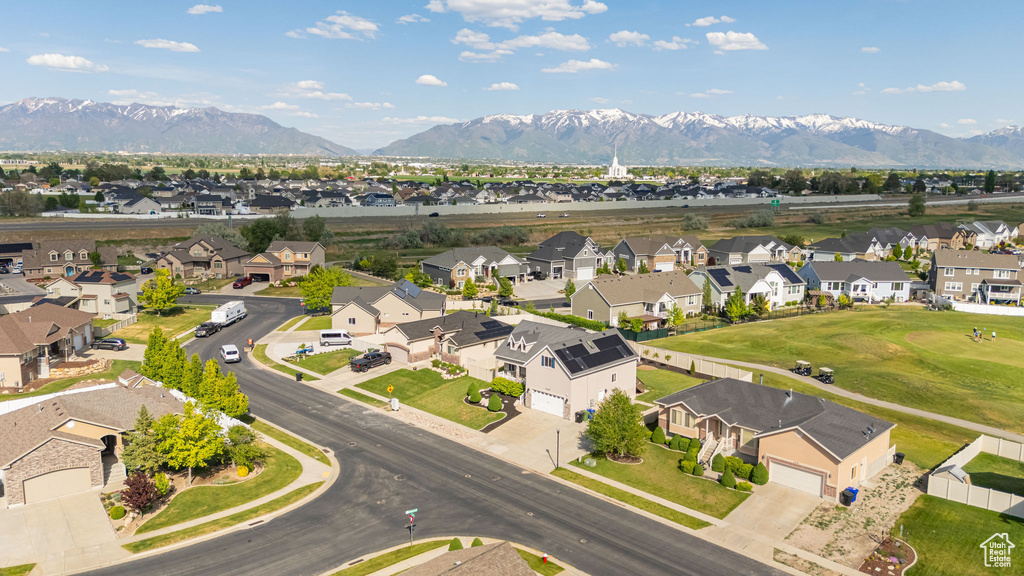 Aerial view of residential area featuring a mountainous background