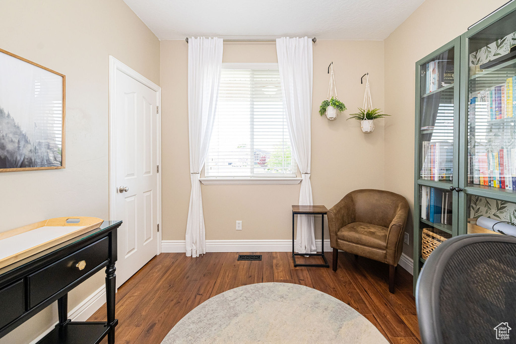 Sitting room featuring wood finished floors and baseboards