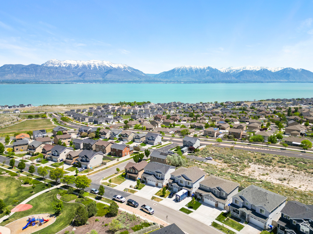 Aerial view of residential area featuring a water and mountain view