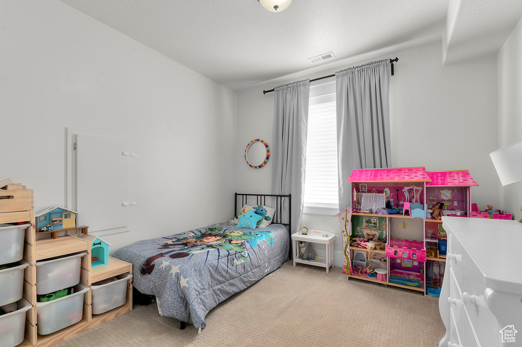 Bedroom featuring carpet flooring