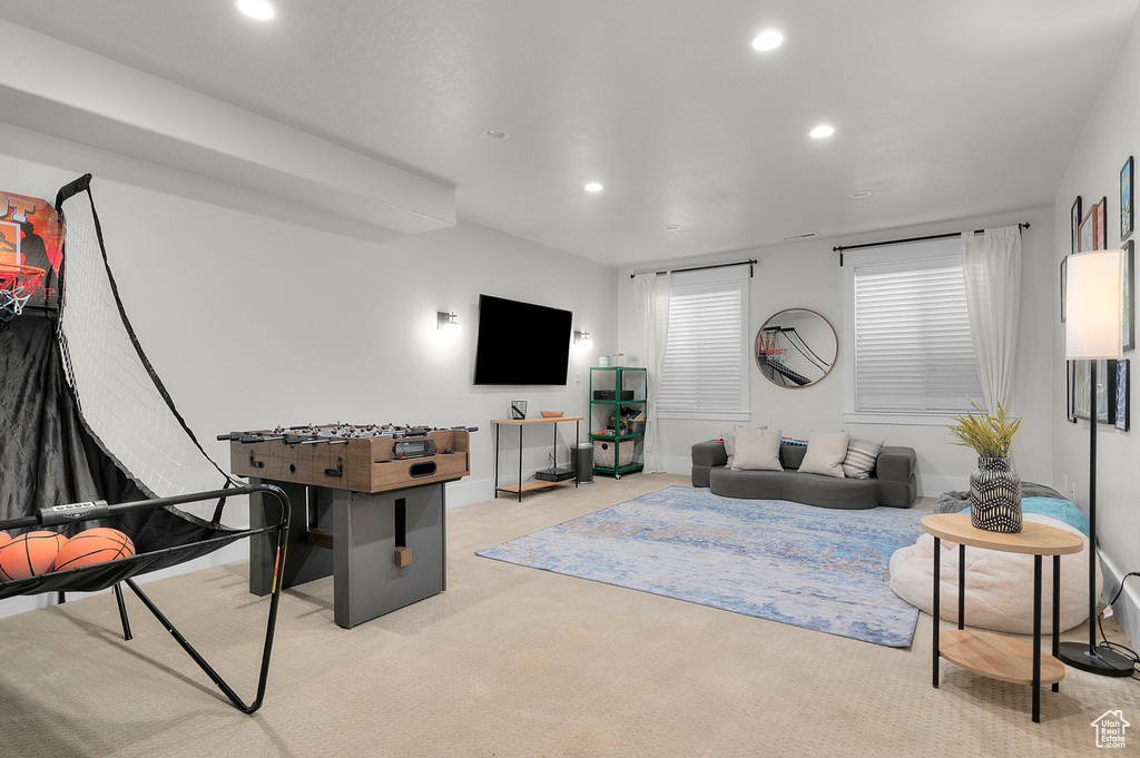 Living area featuring recessed lighting, carpet floors, and baseboards