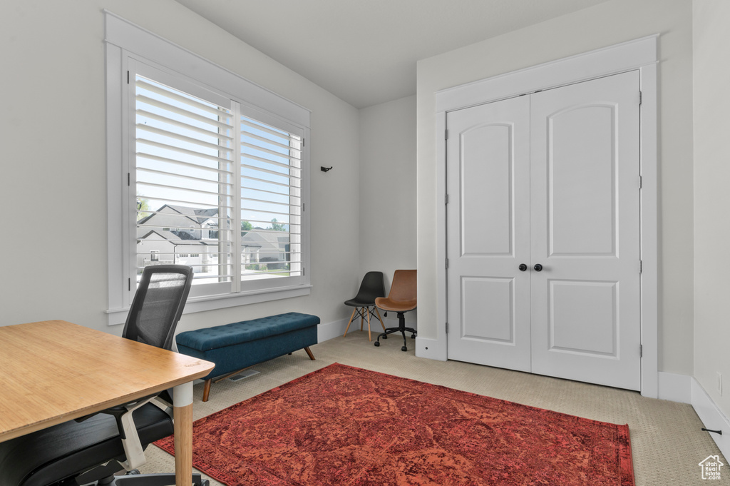 Office with carpet flooring and baseboards