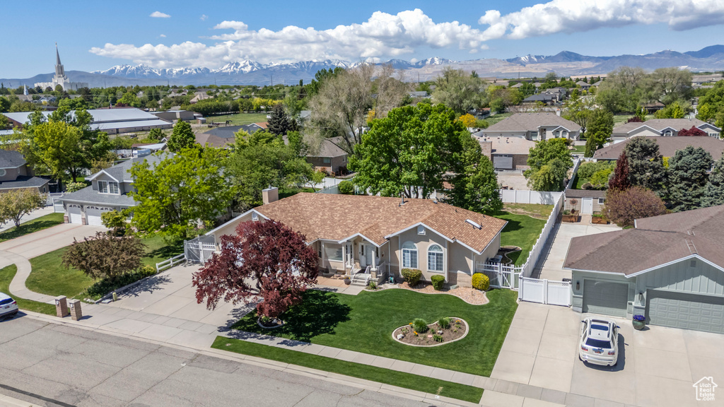 Aerial perspective of suburban area with a mountain backdrop