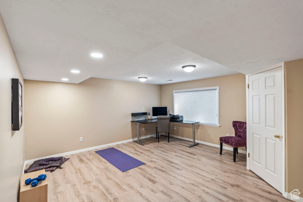 Home office with wood finished floors, baseboards, and recessed lighting