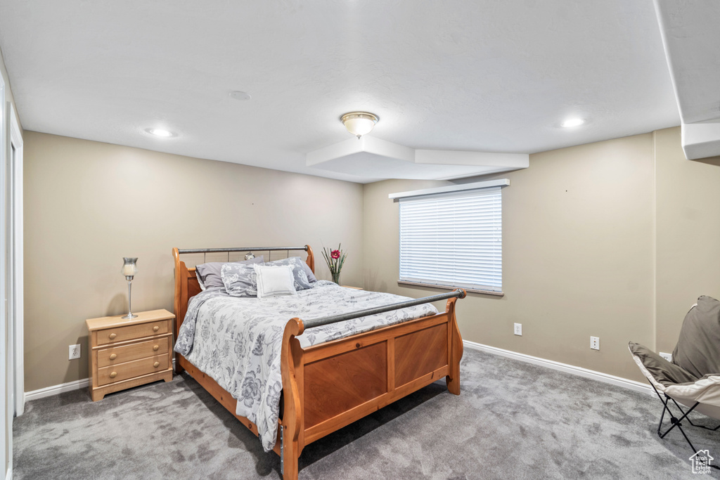 Bedroom featuring light carpet, baseboards, and recessed lighting