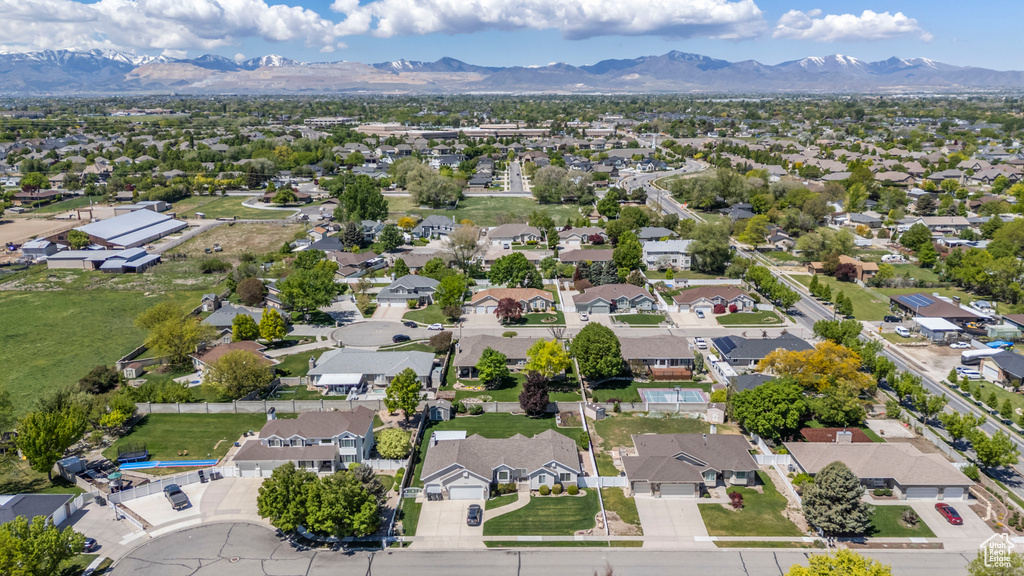 Aerial view of residential area featuring a mountain backdrop