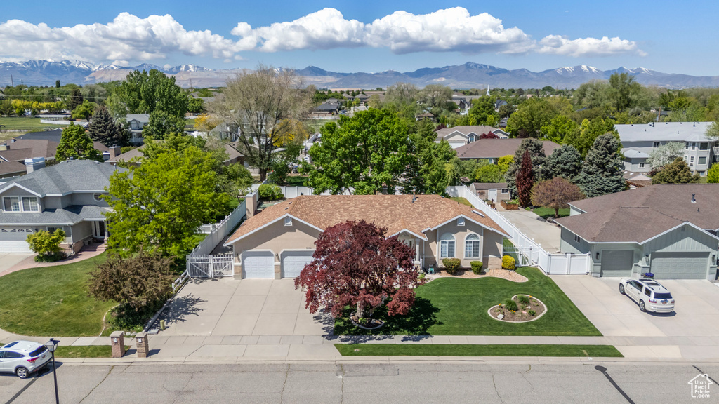 Aerial view of residential area with a mountainous background