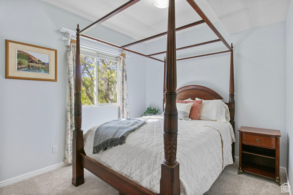 Carpeted bedroom with baseboards