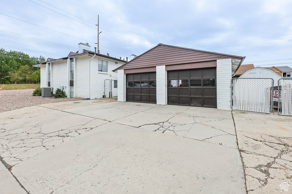 Detached garage featuring central AC unit