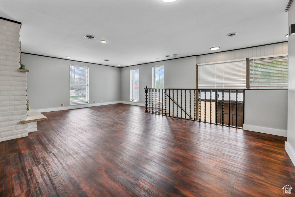 Spare room with baseboards, recessed lighting, and wood finished floors