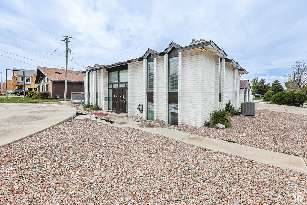 View of property featuring central air condition unit