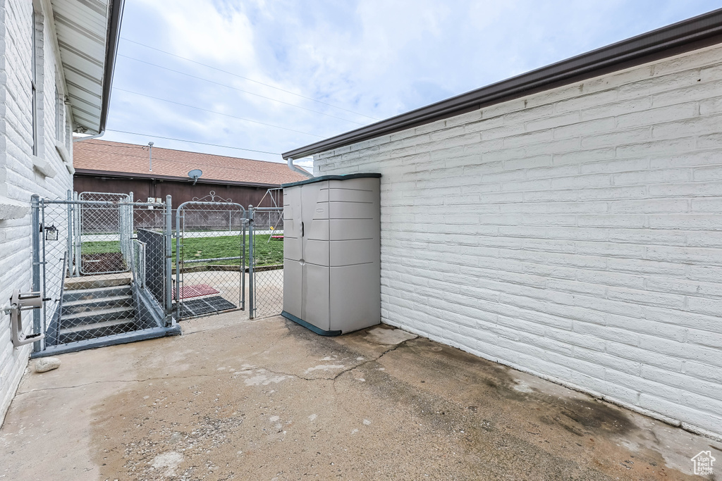 View of patio / terrace with fence and a gate