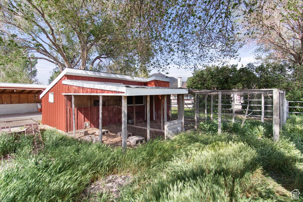 View of poultry coop featuring fence