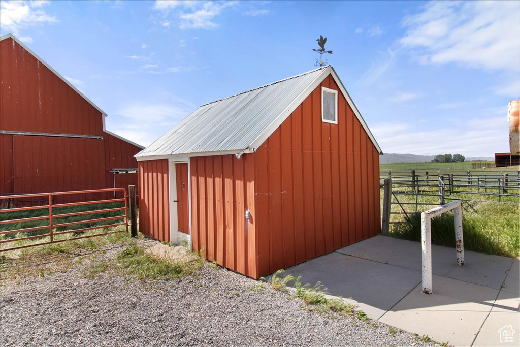 View of barn with fence