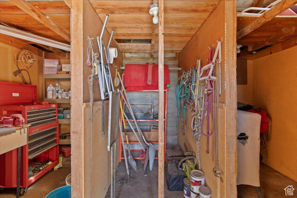Interior space featuring unfinished concrete flooring