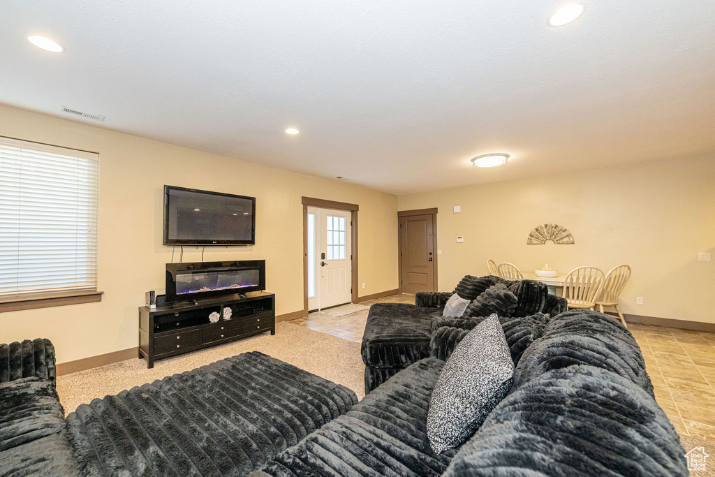 Living room featuring recessed lighting and baseboards
