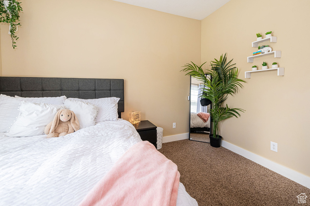 Carpeted bedroom with baseboards